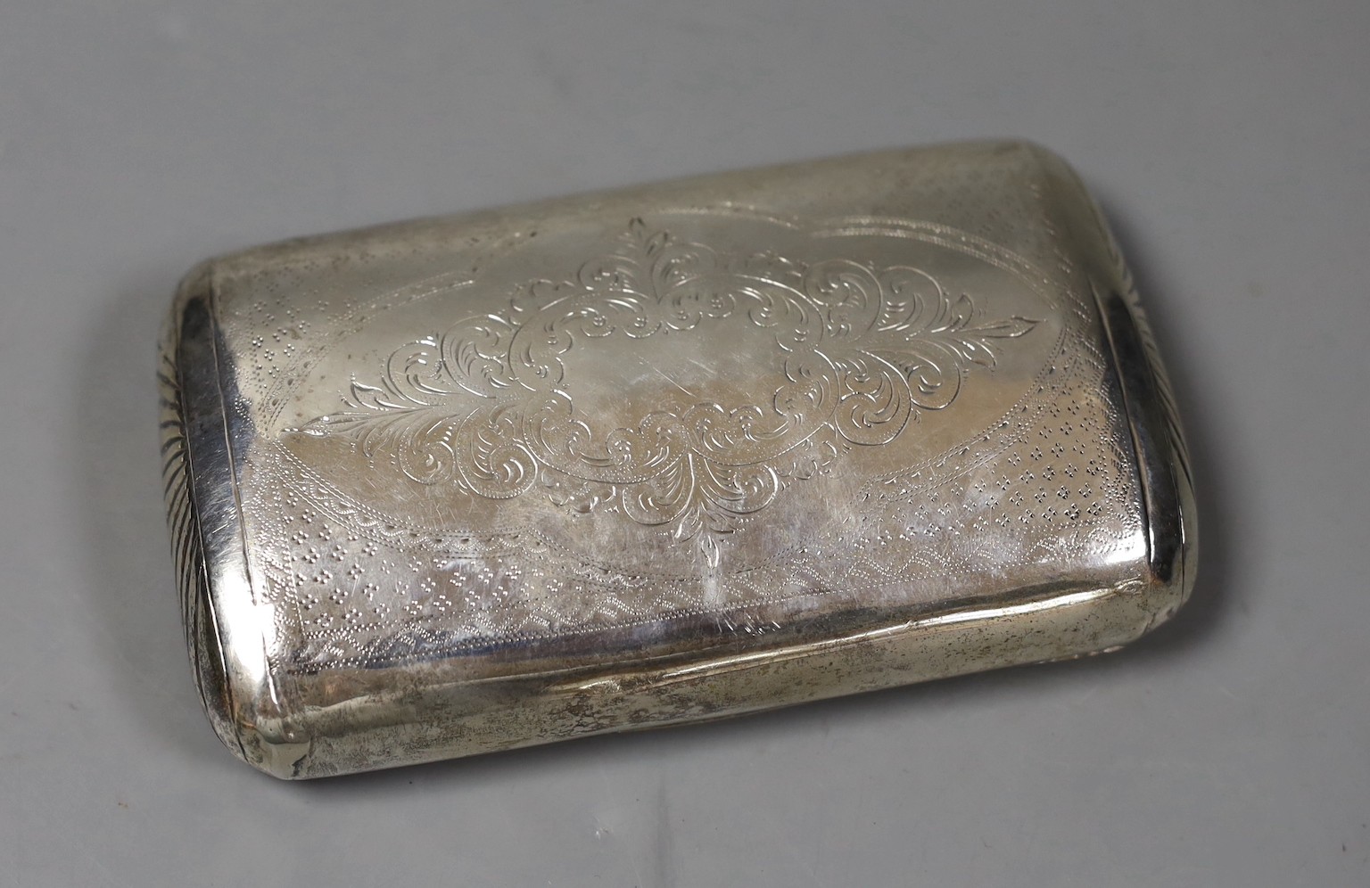 A 19th century Dutch 833 standard white metal tobacco box, engraved with animals in farmyard scene, 13.1cm, 159 grams.